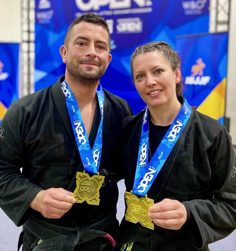 Jamie and Jeremy together, holding medals from Feb 2024 IBJJ tournament